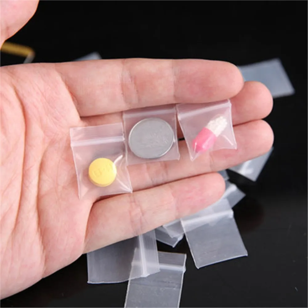 100pcs 미니 플라스틱 저장 가방 Resealable 셀프 씰링 지퍼 작은 비즈니스 보석 저장 포장을위한 명확한 플라스틱 주머니