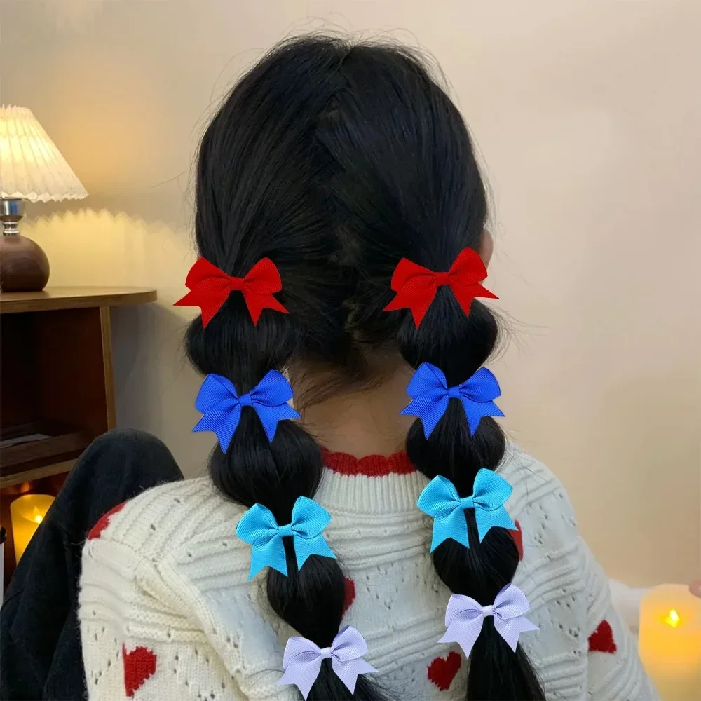 아기 활 10Pcs 새로운 색상 Grosgrain 리본 활 탄성 Hairties 헤어 밴드 여자 봄 머리 밧줄 헤어 액세서리 도매