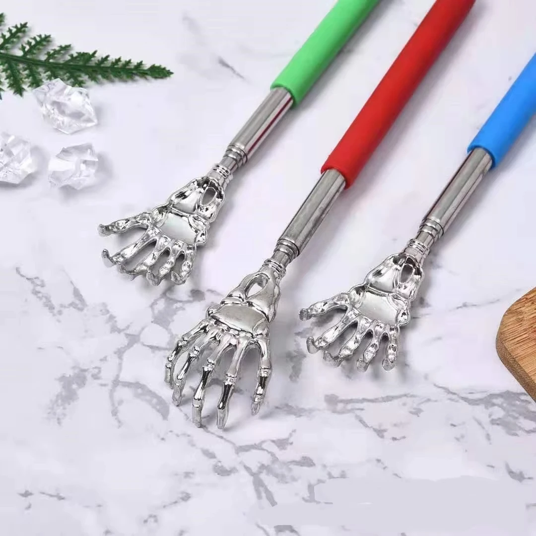 해골 팜 텔레스코픽 등긁개 핸드 마사지기 고무 손잡이가 있는 등받이 마사지기 재미있고 참신한 압력 해소 핸드 스틱